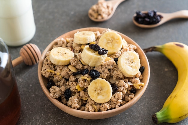 granola with banana, raisin and milk 