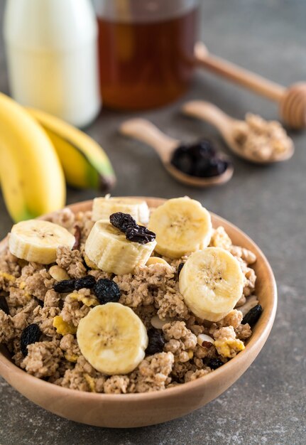 granola with banana, raisin and milk 