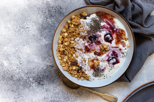 Granola with nuts, greek yogurt and jam