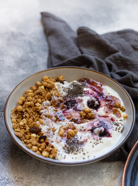 Granola with nuts, greek yogurt and jam