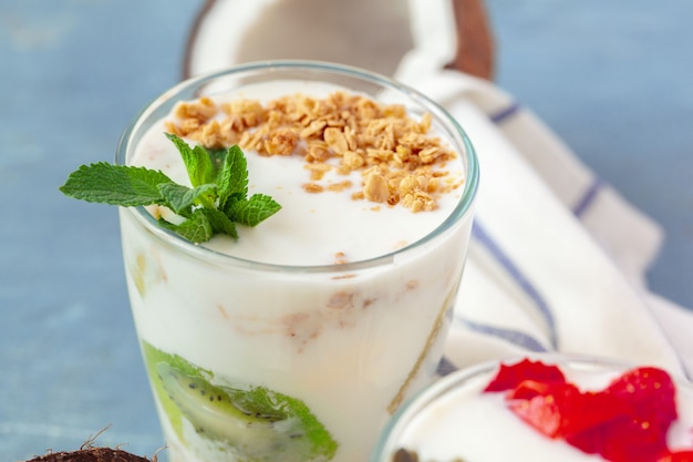 Granola with yogurt and berries for healthy breakfast on a table