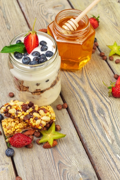 Granola, yogurt and strawberries in a jars