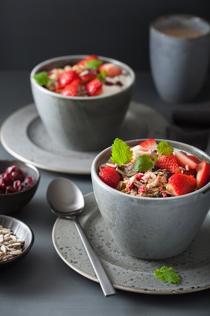 Granola and yogurt with seeds and strawberry for breakfast