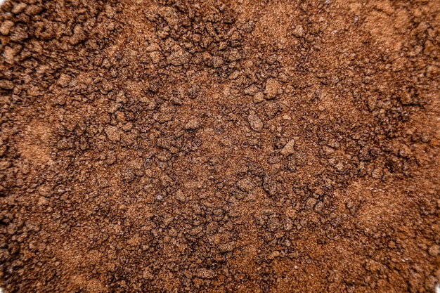 Granulated milk chocolate texture background