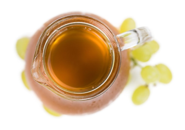 Grape Juice as detailed closeup shot isolated on white background selective focus