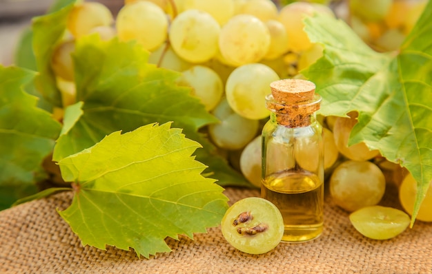 Grape seed extract in a small jar. Selective focus.