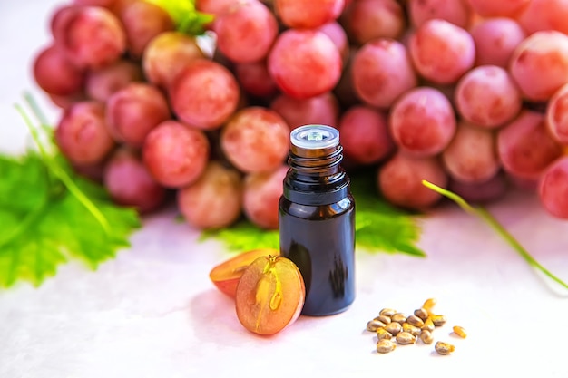 Grape seed oil in a bottle. Selective focus. Nature.