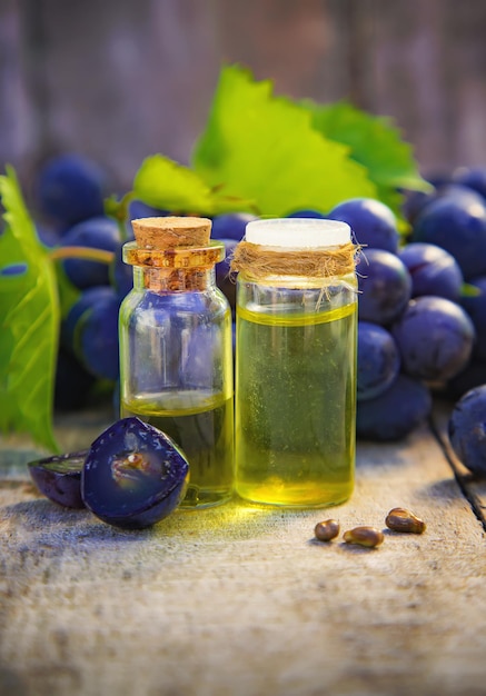 Grape seed oil in a bottle Selective focus Nature