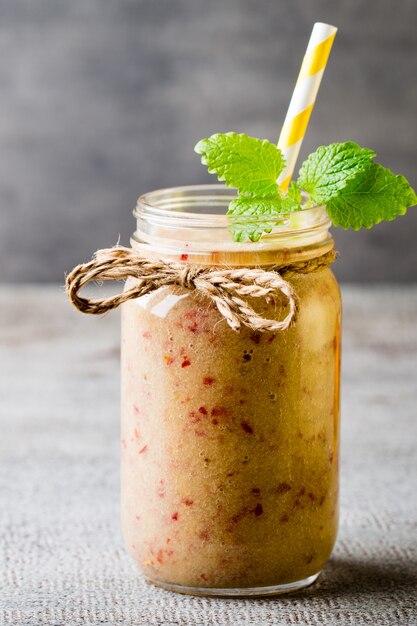 Grape smoothie, on the grey  table