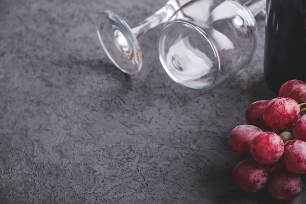 Grape, wine on grey table with copy space