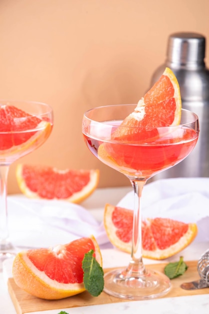 Grapefruit martini cocktail with cold champagne