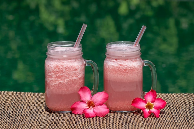 Grapefruit pink shake or smoothie on the table close up Breakfast in island Bali Indonesia