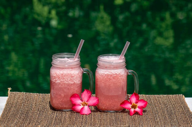 Grapefruit pink shake or smoothie on the table close up Breakfast in island Bali Indonesia