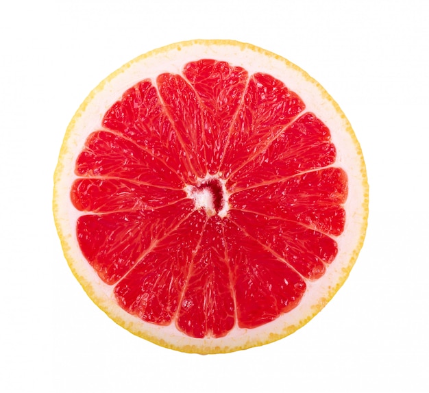 grapefruit slice on white wall