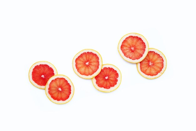 Grapefruit slices on white background