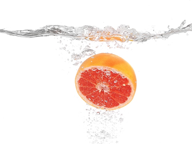 Grapefruit in water on white background