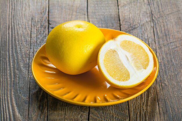 Grapefruit on a wooden table