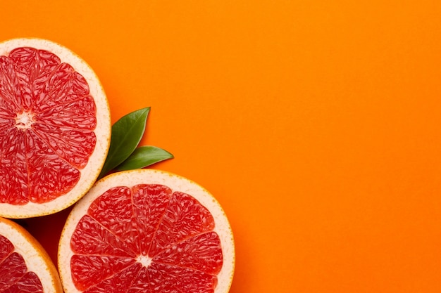 Grapefruits on an orange background