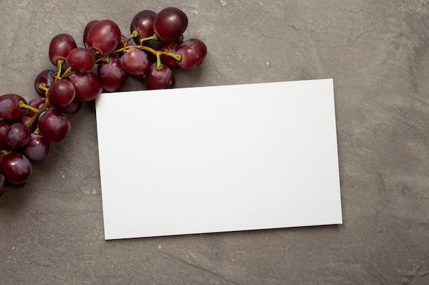 Photo grapes of design white paper mockup enhanced by the juicy allure of fresh grapes