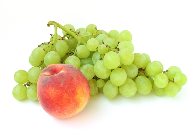 The grapes of green grapes and peach are isolated