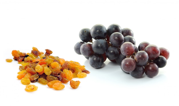 Grapes with raisins isolated on white