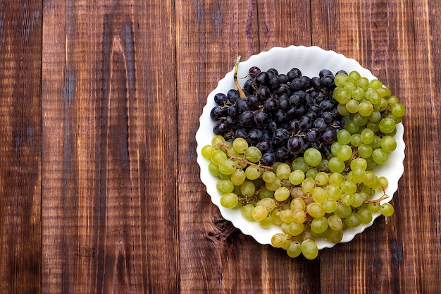 Grapes on wooden background