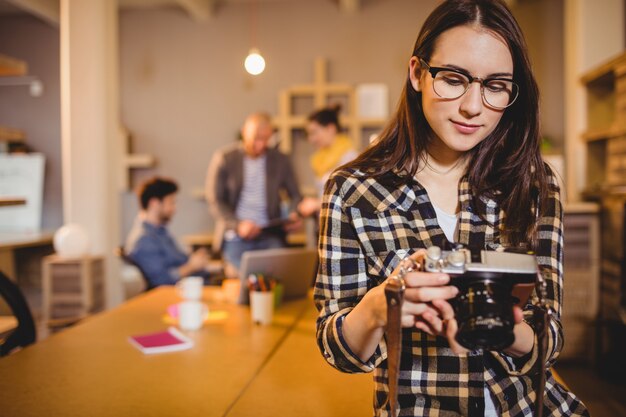 Graphic designer checking pictures in camera