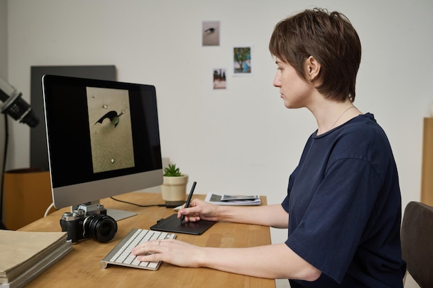 Graphic designer editing photo on computer