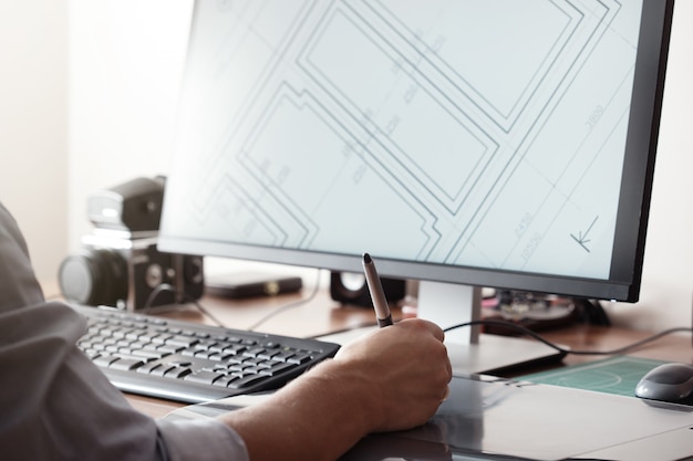 graphic designer using digital tablet and computer in office or home. creative process. people at work.