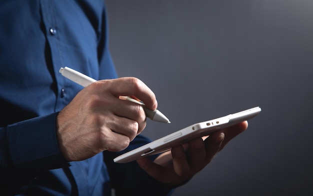 Graphic designer using tablet computer in office