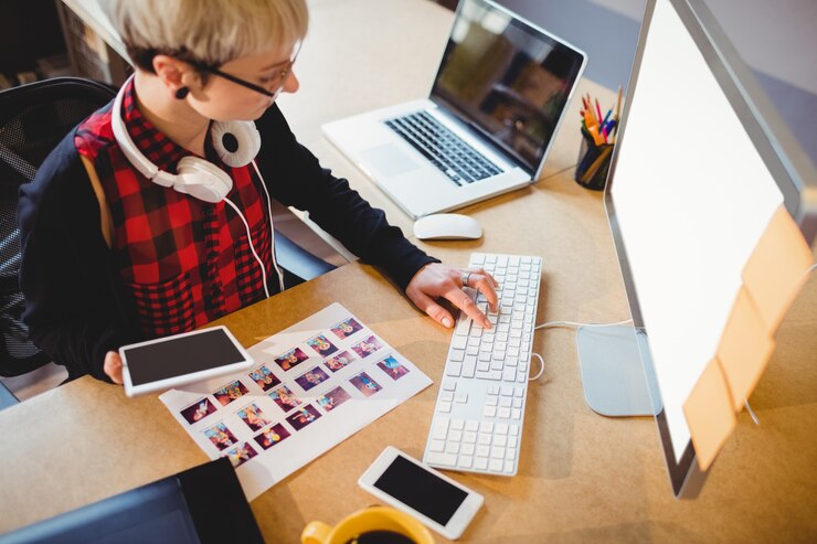 Photo graphic designer working on computer
