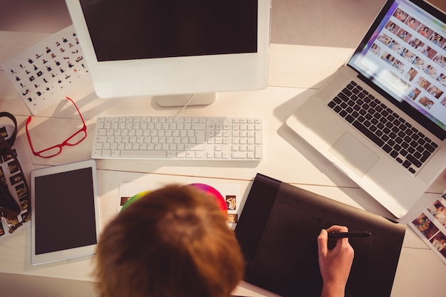 Graphic designer working at desk