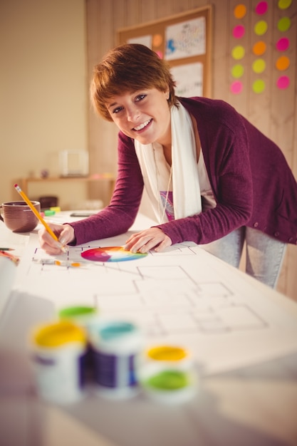 Graphic designer working at desk