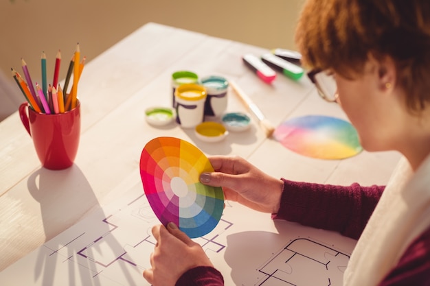 Graphic designer working at desk