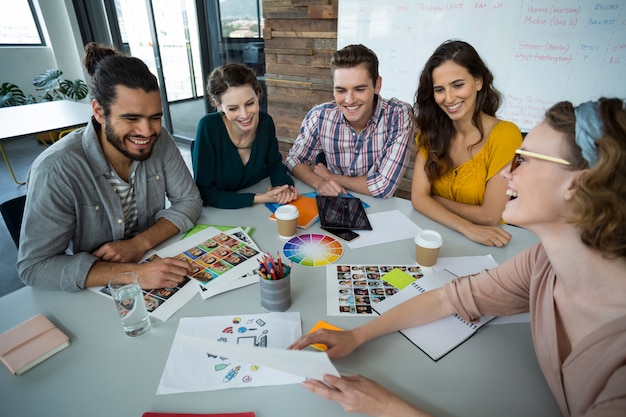 Graphic designers discussing with each other in meeting