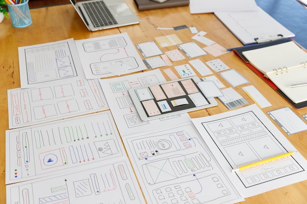 Graphic designers work together with UX UI designer planning application