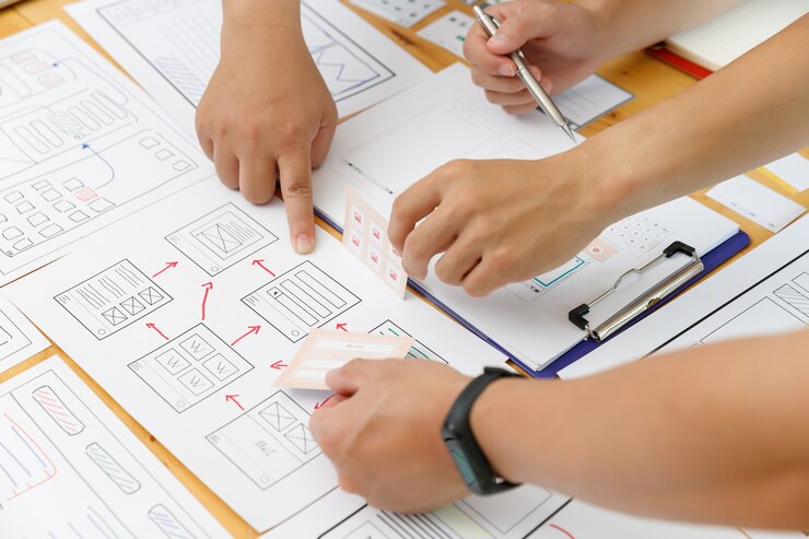 Photo graphic designers work together with ux ui