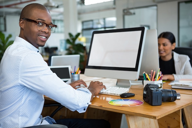 Graphic designers working at desk