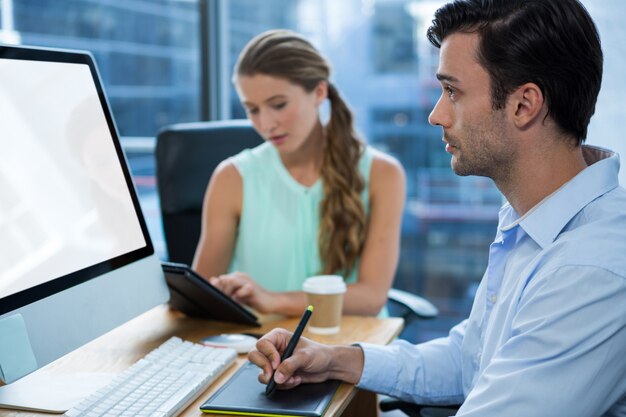 Graphic designers working at desk