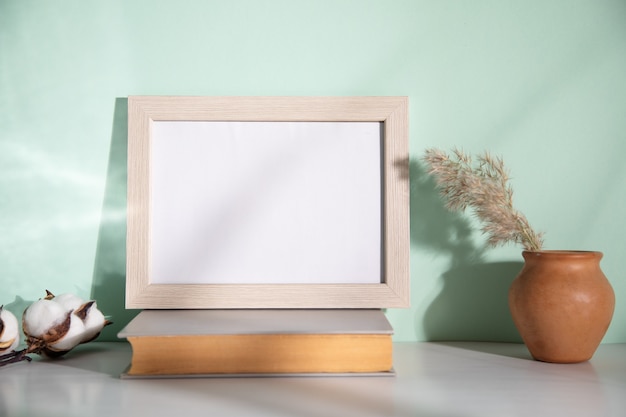 Grass and photo frame on the book