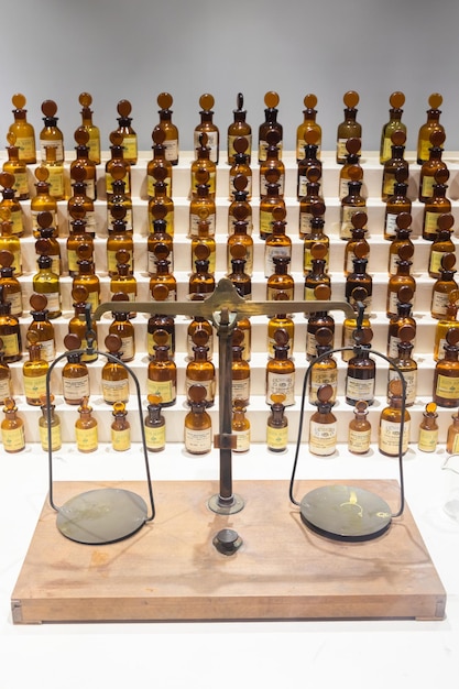 Grasse France collection of ancient perfumes in laboratory with vintage balance