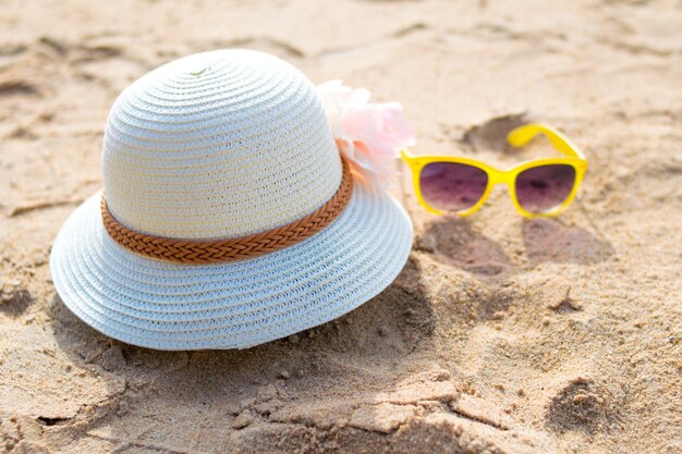 grasses and sun hat on the beach