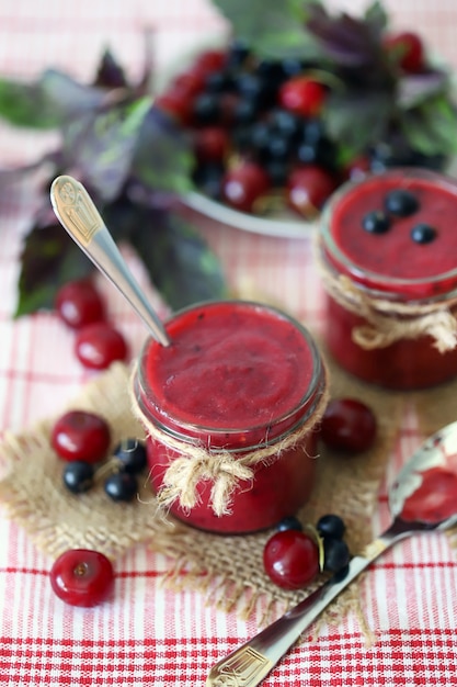 Grated berries of black currant and cherries.