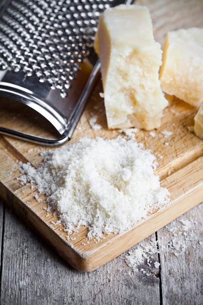 Grated parmesan cheese and metal grater