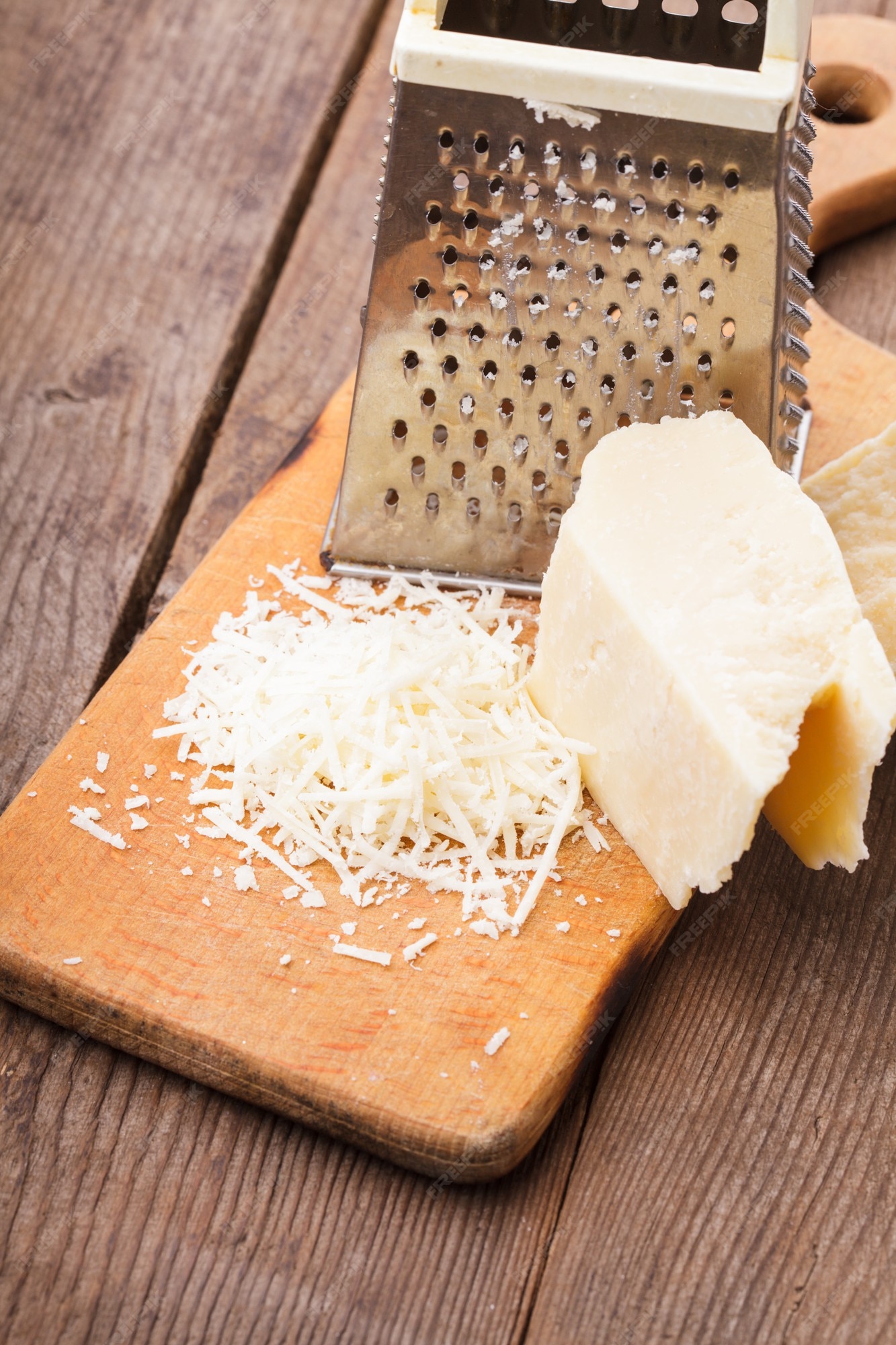 Parmesan Cheese With Grater Stock Photo - Download Image Now