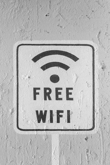 Foto gratis wifi-teken op witte bakstenen muur