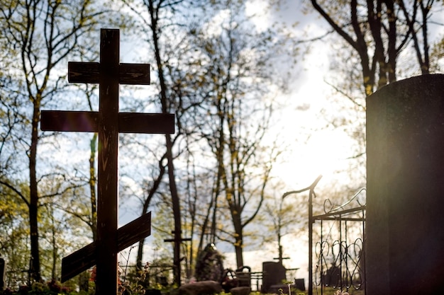 Grave cross on the Orthodox Christian cemetery at sunny day