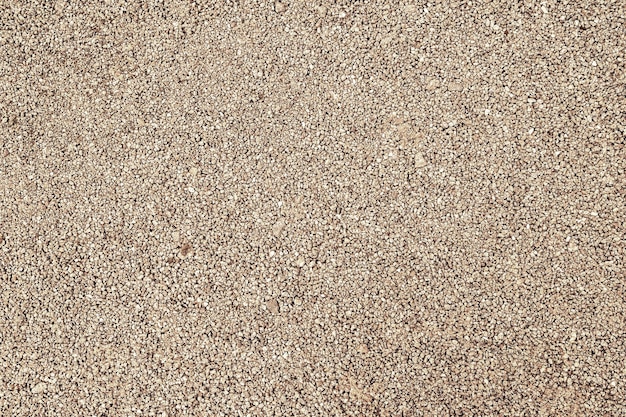 Gravel texture Fine brown granite stone gravel Natural textural background