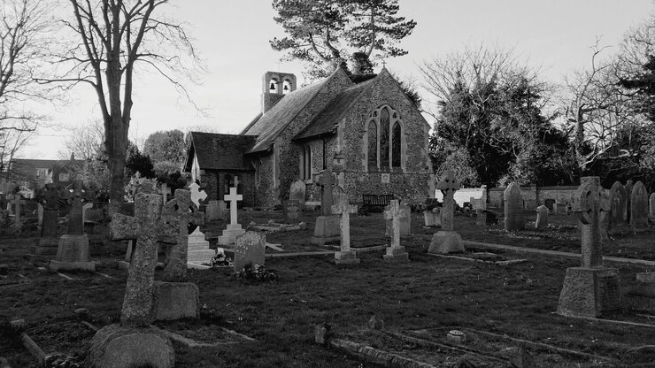 Photo graveyard with rows of grave and chapel