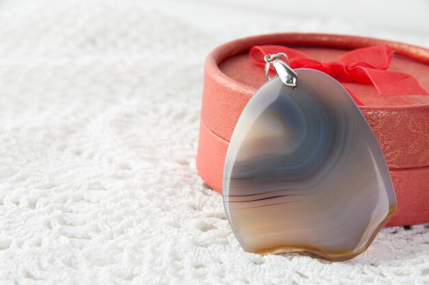 Gray agate pendant and red box